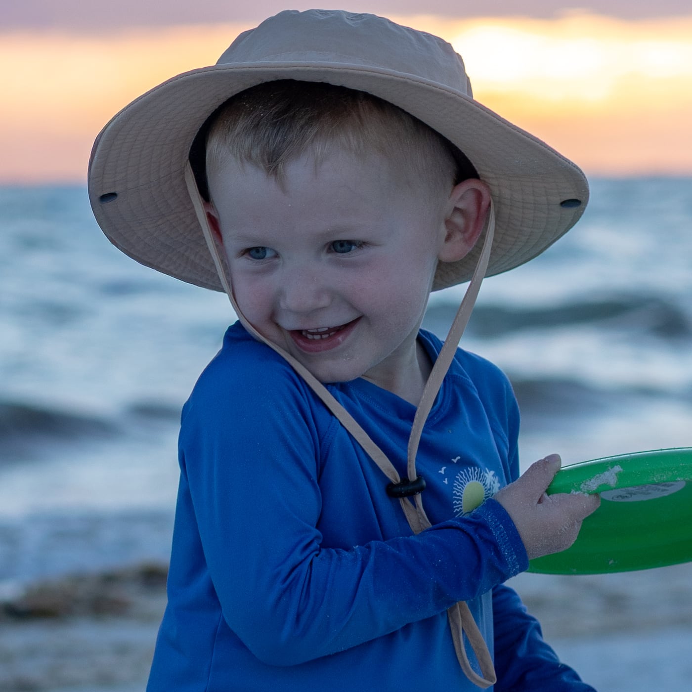 Alex Fernandez's son smiling at the beach