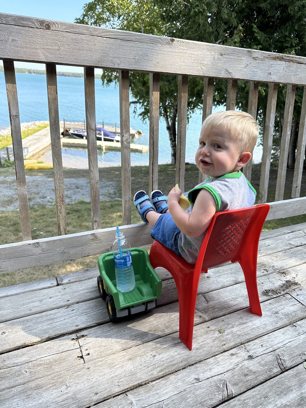 Alex Fernandez's son sitting by the lake